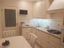 Kitchen design with refrigerator and TV