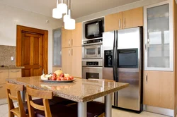 Kitchen design with refrigerator and TV