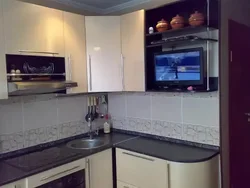 Kitchen design with refrigerator and TV