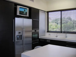 Kitchen design with refrigerator and TV