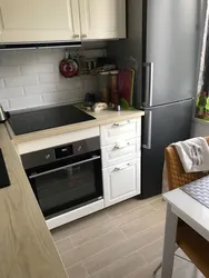 Kitchen in Khrushchev design with refrigerator and dishwasher