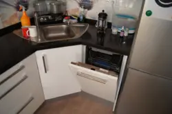 Kitchen In Khrushchev Design With Refrigerator And Dishwasher