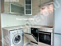 Kitchen in Khrushchev design with refrigerator and dishwasher