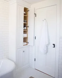 Cabinets to the ceiling for the bathroom photo