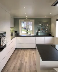 Gray kitchen interior with brown floor