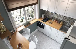 Design of a one-room apartment kitchen by the window