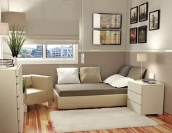 Photo of the interior of a small bedroom with a sofa
