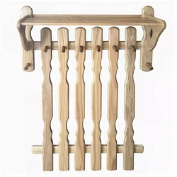 Photo of wall-mounted wooden clothes hangers in the hallway