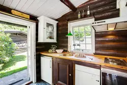 Photo of a kitchen in a country house with a window