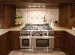 Gas stove in the interior of a small kitchen photo