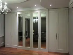 Hallway with swing doors and mirror photo