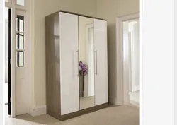 Hallway with swing doors and mirror photo