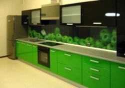 Photo of black and light green kitchen