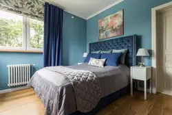 Blue bed in the bedroom interior