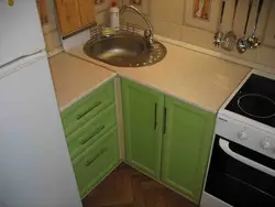 Small kitchen design photo sink in the corner