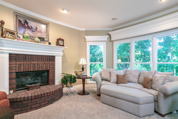 Bedroom design with sofa and fireplace