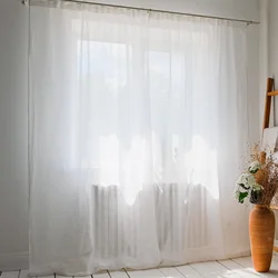 Tulle under linen in the living room interior