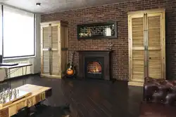 Photo of a loft-style living room with a fireplace