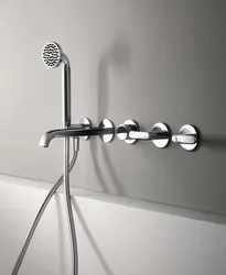 Bathroom faucet with shower built into the bathtub photo