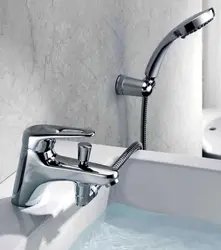 Bathroom faucet with shower built into the bathtub photo