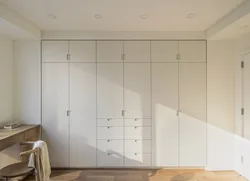 Built-in wardrobes in the bedroom up to the ceiling design