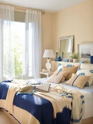 Bedroom interior in blue and beige tones