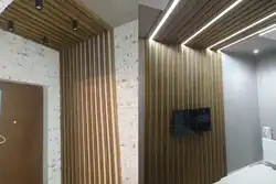 Wooden slats on the wall in the interior photo hallway