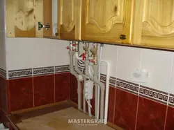 How to close the pipes in the kitchen in the corner photo