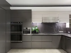 Gray white kitchen with black countertop photo