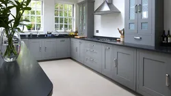 Gray white kitchen with black countertop photo