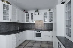 Gray white kitchen with black countertop photo