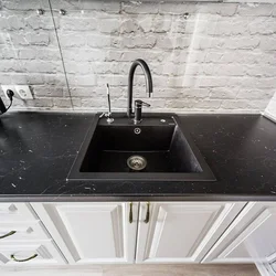 Black sink in the kitchen interior