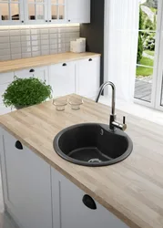 Black sink in the kitchen interior