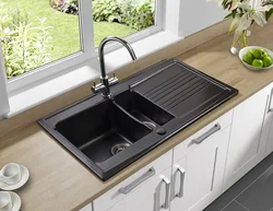 Black sink in the kitchen interior