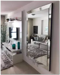 Living room with wall-to-wall mirror photo