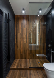 Photo of a bathroom with a black shower