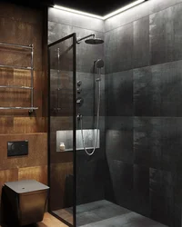 Photo of a bathroom with a black shower