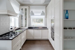 U-shaped kitchen with sink by the window photo