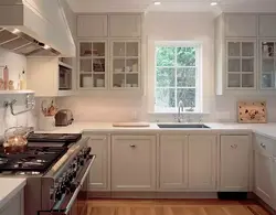 U-shaped kitchen with sink by the window photo