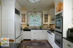 U-Shaped Kitchen With Sink By The Window Photo