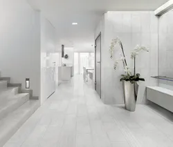 Light porcelain tiles in the bathroom interior photo