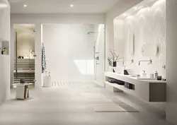 Light porcelain tiles in the bathroom interior photo