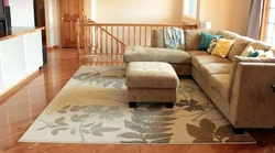 Carpet for a living room in a modern style with a corner sofa photo
