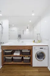 Bath design with a cabinet for a washing machine