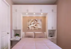 Bedroom design with two wardrobes next to the bed