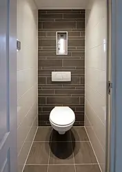 Interior Of A Small Toilet In An Apartment Separate From The Bathtub In A Panel