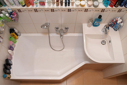 Sink and bathtub with one faucet photo