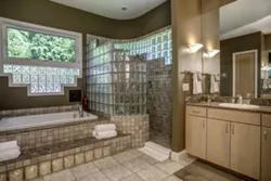 Bathtub with glass block partition photo