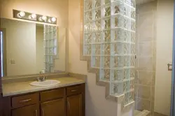 Bathtub with glass block partition photo