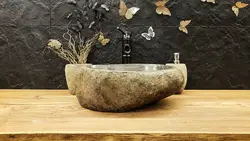 Stone sink in the bathroom interior